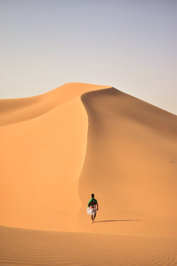 Man walking through a desert