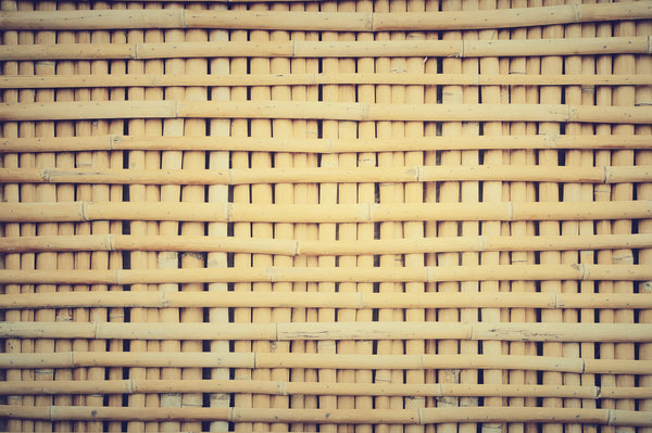 Background of a sheet of large amount of dry bamboo interwoven together